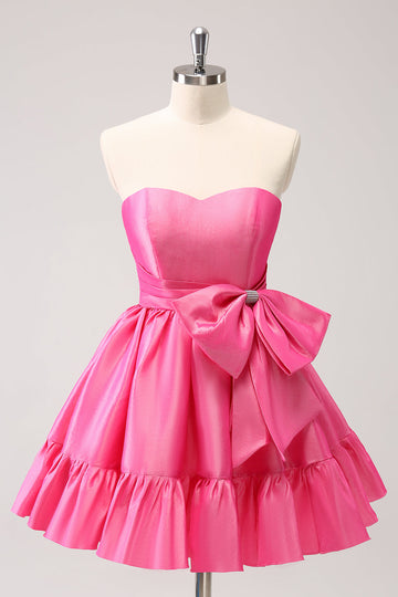 Vestido de fiesta corto fucsia con volantes sin tirantes y corte A con lazo